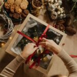 top view of woman packing a christmas present